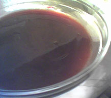 a bowl of dark brown jus